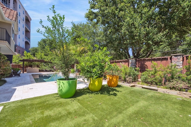 view of yard with a pergola and a patio