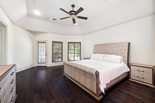 bedroom featuring a raised ceiling, ceiling fan, crown molding, and dark hardwood / wood-style floors