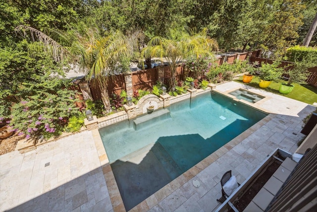 view of pool featuring an in ground hot tub