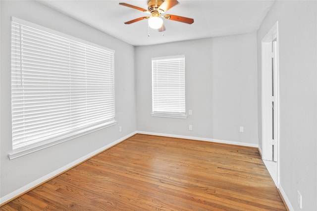 empty room featuring ceiling fan and light hardwood / wood-style floors