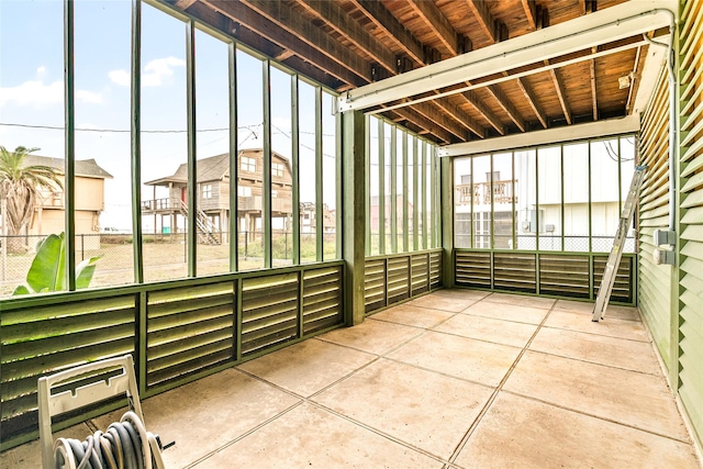 unfurnished sunroom with heating unit