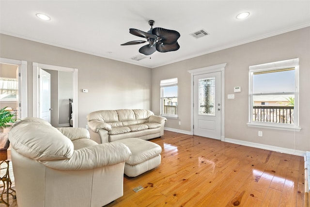 living room with ceiling fan, hardwood / wood-style floors, and ornamental molding