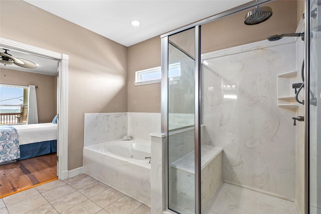 bathroom with tile patterned floors and independent shower and bath