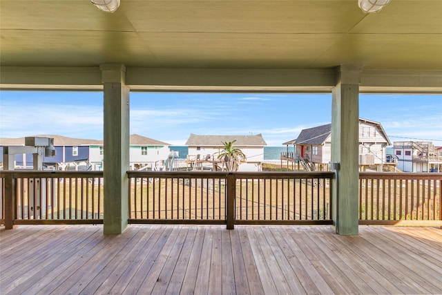 wooden deck featuring a water view