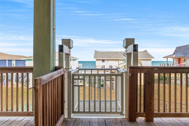 wooden terrace with a water view