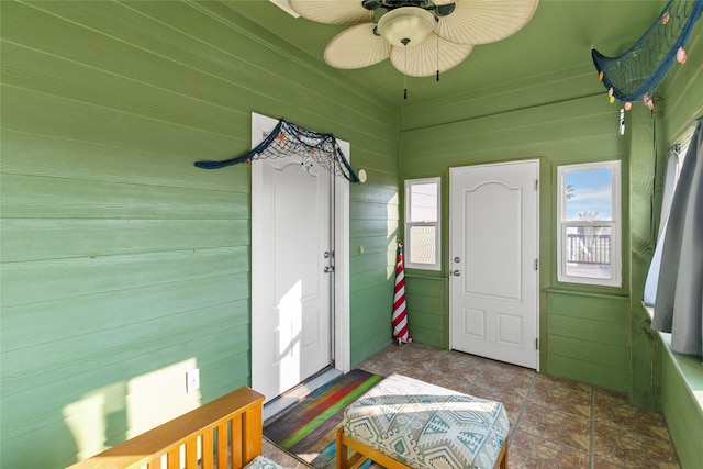 sunroom / solarium with ceiling fan