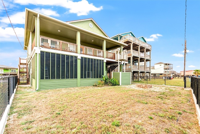 back of property with a lawn