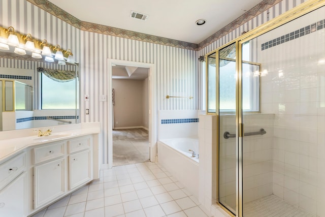 bathroom with vanity, tile patterned floors, and plus walk in shower