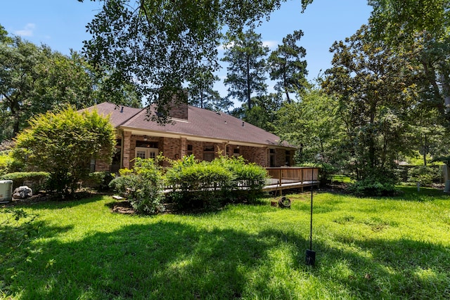 view of yard featuring a wooden deck