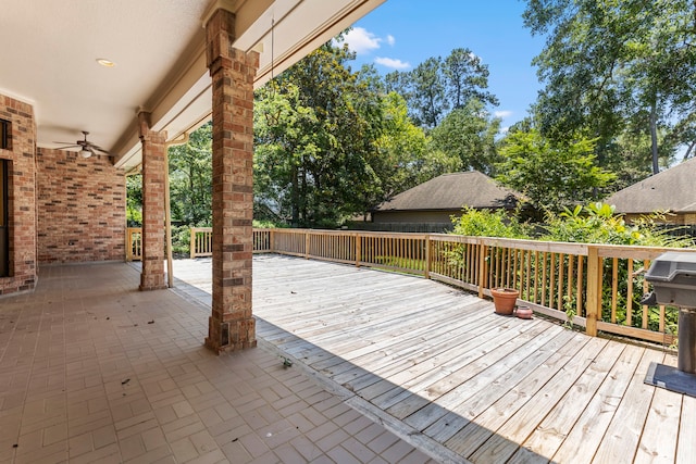 exterior space with ceiling fan