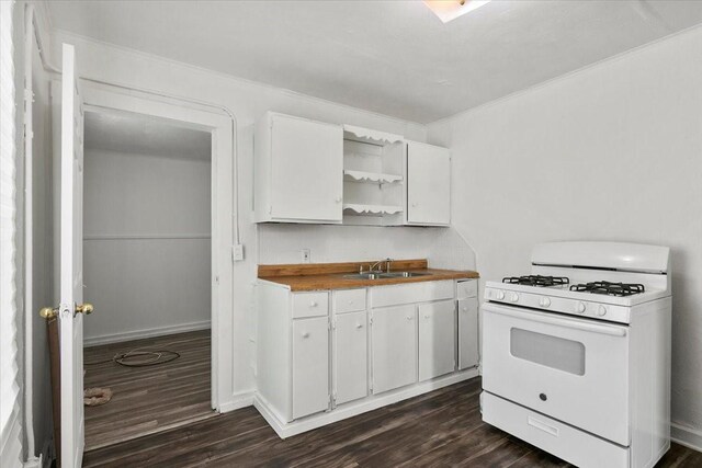 kitchen featuring a sink, white cabinetry, dark wood-style floors, open shelves, and white gas range