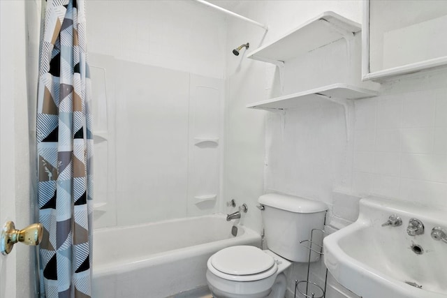 full bathroom with sink, shower / tub combo with curtain, and toilet