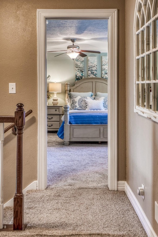 bedroom with ceiling fan and carpet