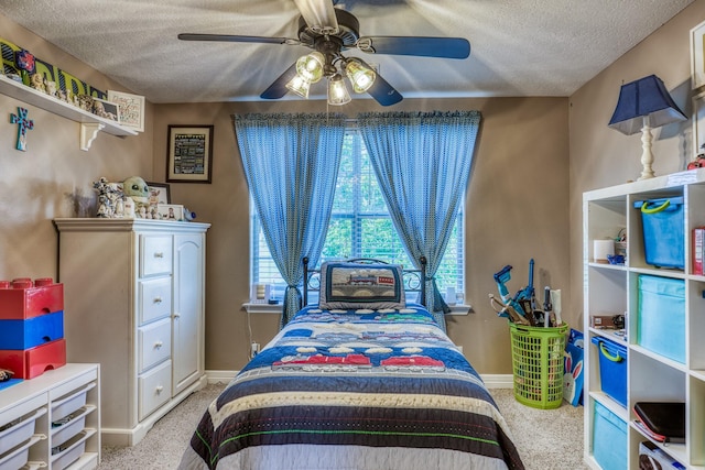 bedroom featuring light carpet, a textured ceiling, and ceiling fan