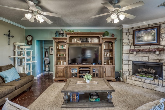 tiled living room featuring ceiling fan, a textured ceiling, and a fireplace