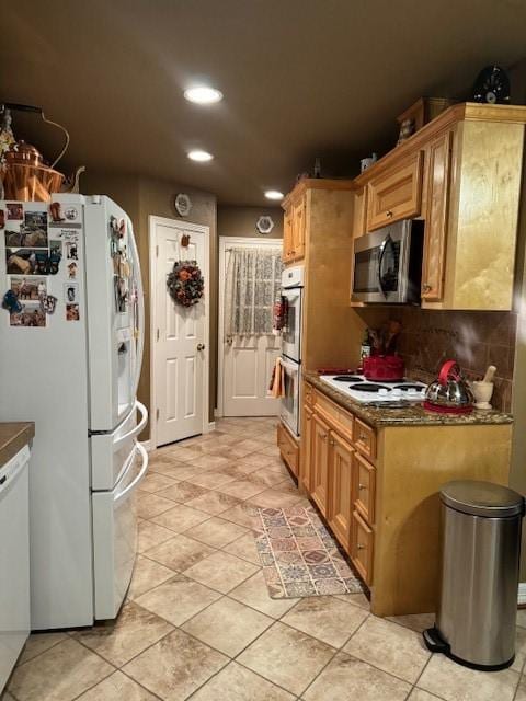 kitchen with light tile patterned flooring, recessed lighting, stainless steel appliances, tasteful backsplash, and dark countertops