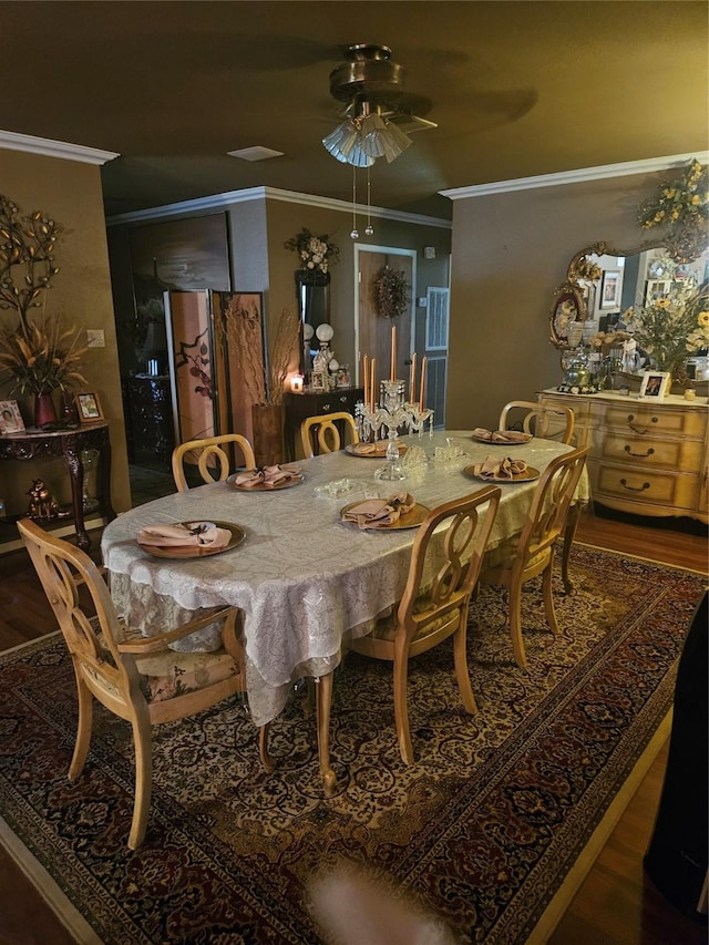 dining area with ornamental molding, ceiling fan, and wood finished floors