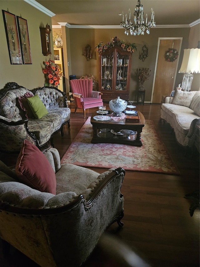 living area with ornamental molding, wood finished floors, and an inviting chandelier