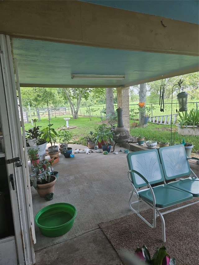 view of patio featuring fence