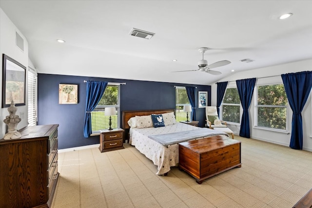 carpeted bedroom featuring ceiling fan and lofted ceiling