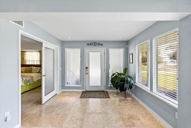 foyer entrance with french doors and a wealth of natural light