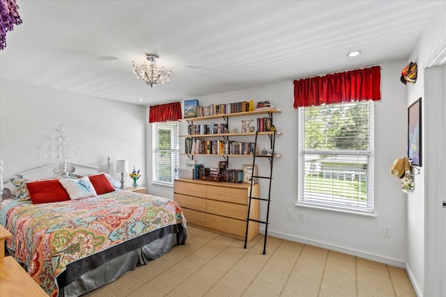 carpeted bedroom featuring multiple windows