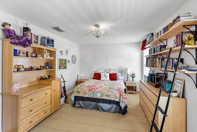 bedroom featuring a notable chandelier