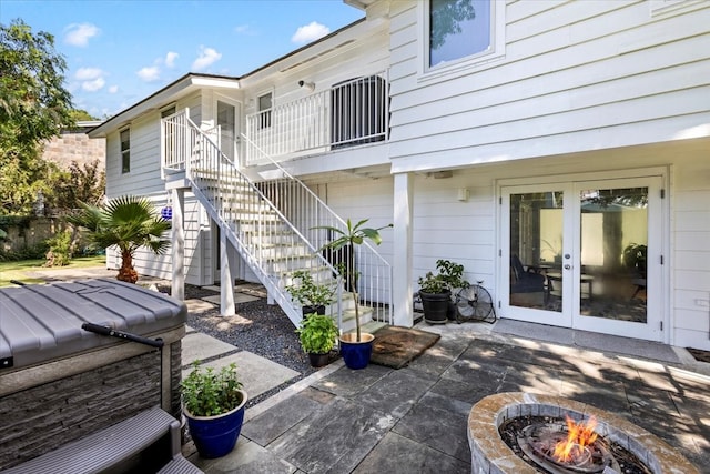 view of patio featuring french doors and an outdoor fire pit