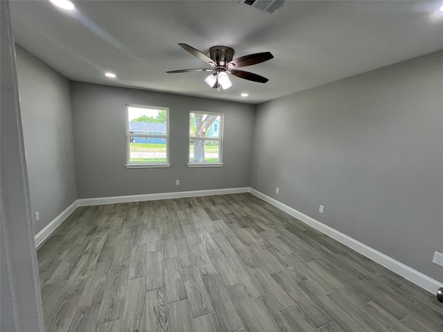 unfurnished room featuring ceiling fan and hardwood / wood-style flooring