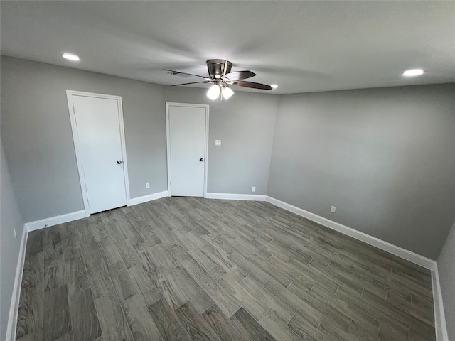 unfurnished room with hardwood / wood-style floors and ceiling fan