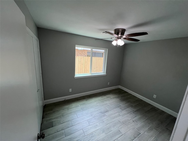 spare room featuring light hardwood / wood-style flooring and ceiling fan