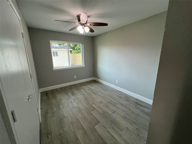 unfurnished room featuring ceiling fan and light hardwood / wood-style floors