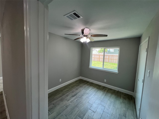 spare room with ceiling fan and light wood-type flooring