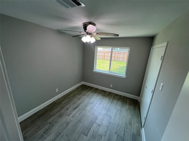 unfurnished bedroom with ceiling fan and wood-type flooring