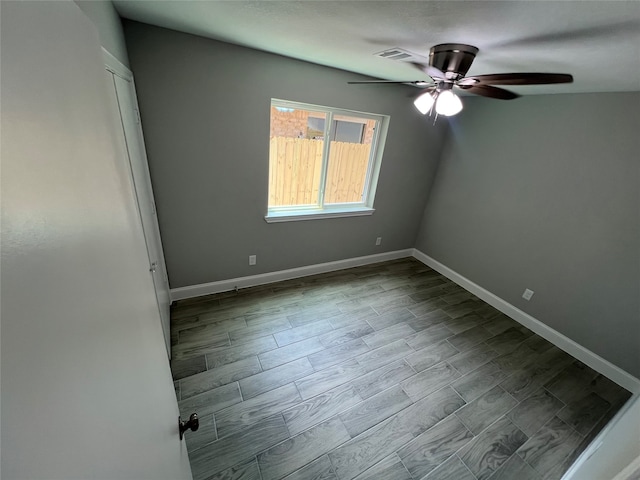 empty room with ceiling fan and wood-type flooring