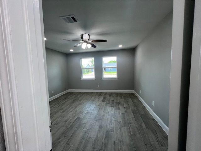 empty room with ceiling fan and hardwood / wood-style floors