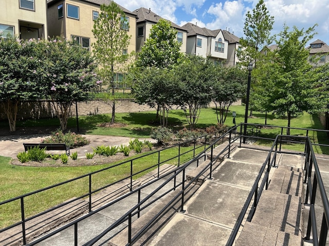 view of home's community featuring a lawn