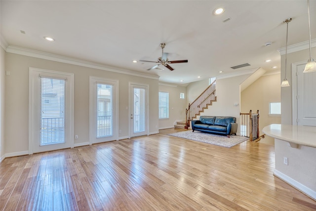 entryway featuring ceiling fan, light hardwood / wood-style floors, and ornamental molding