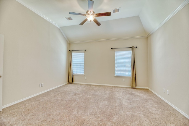 unfurnished room with ornamental molding, light carpet, and vaulted ceiling