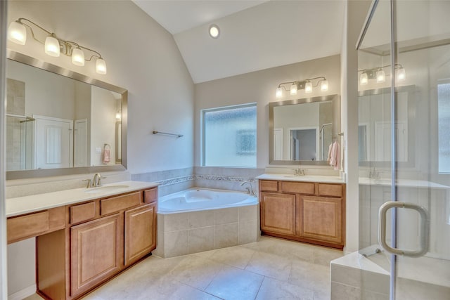 bathroom featuring tile patterned flooring, vanity, plus walk in shower, and vaulted ceiling