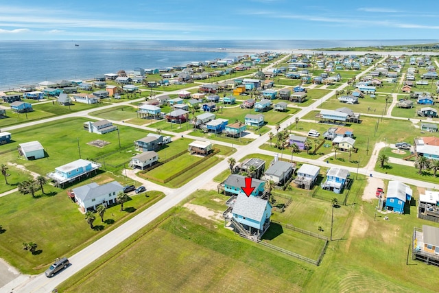 birds eye view of property with a residential view and a water view