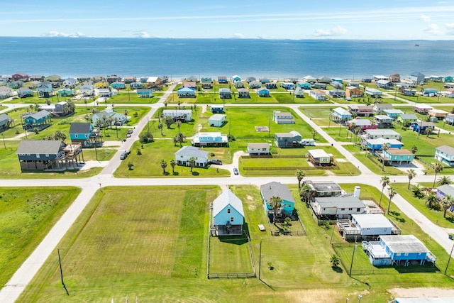 drone / aerial view featuring a residential view and a water view