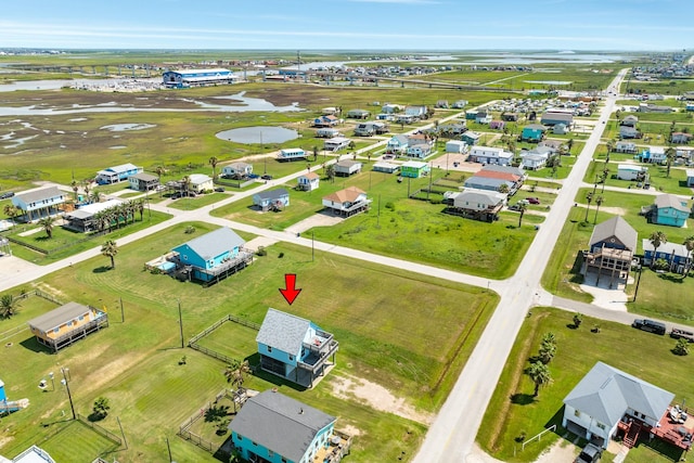 bird's eye view featuring a residential view and a water view