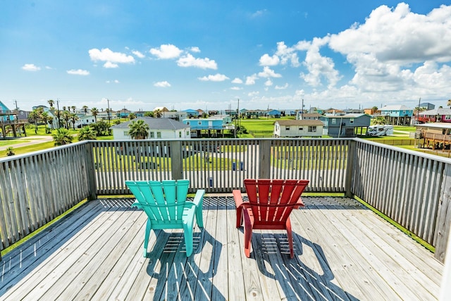 wooden terrace with a residential view