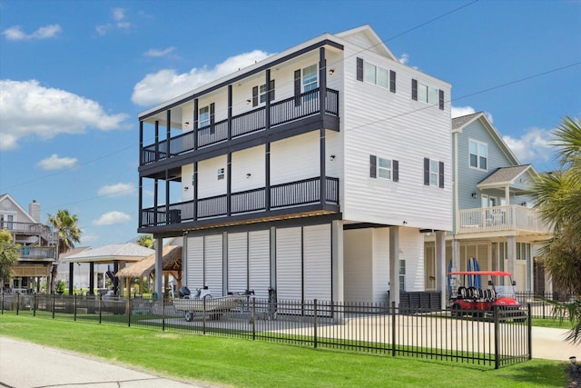 exterior space featuring a yard and a balcony