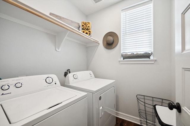 laundry room featuring dark hardwood / wood-style floors and independent washer and dryer