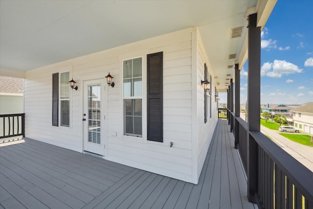 wooden deck featuring covered porch