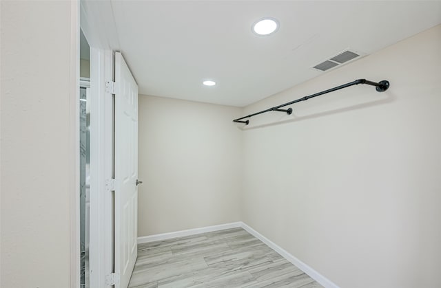 spacious closet with light wood-type flooring