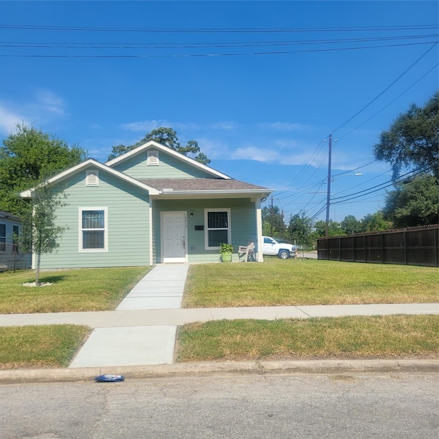 bungalow with a front lawn