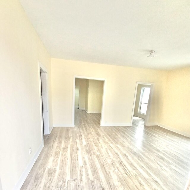 unfurnished room featuring light wood-type flooring